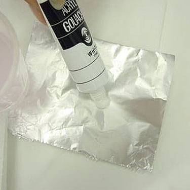                                              Put some acrylic paint onto sheet of paper or foil.
                                             